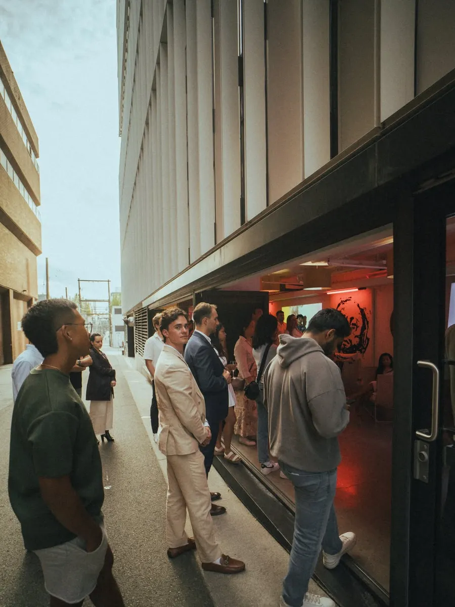 Members talking outside the July 30 venue in a Vancouver lane